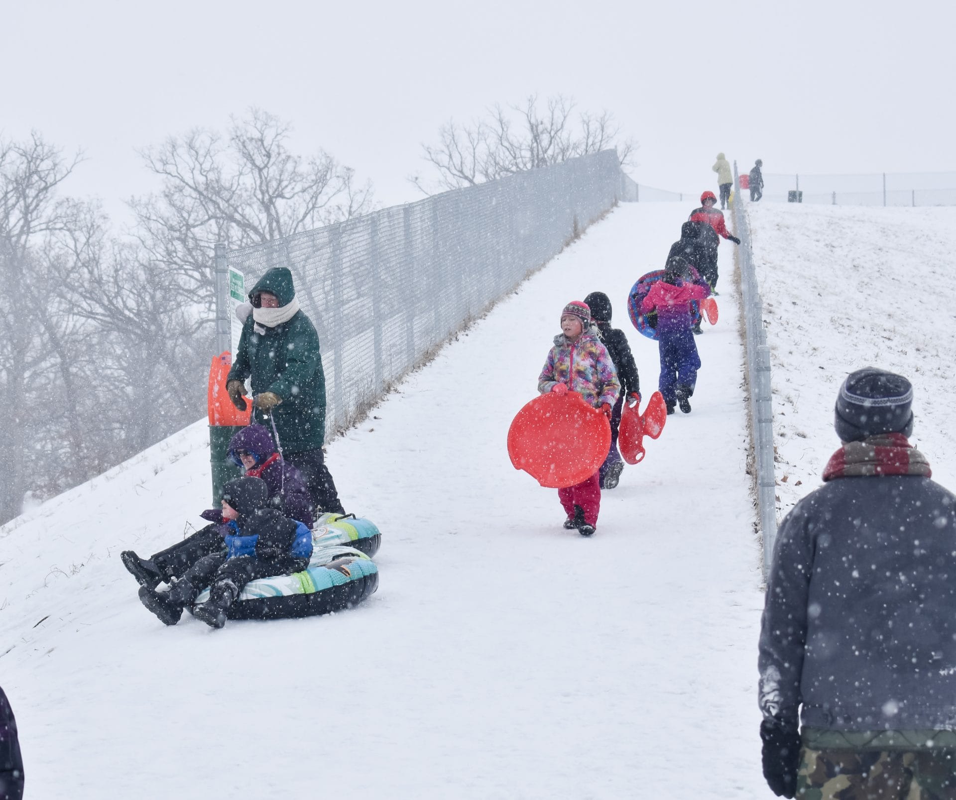 people sledding in DeKalb