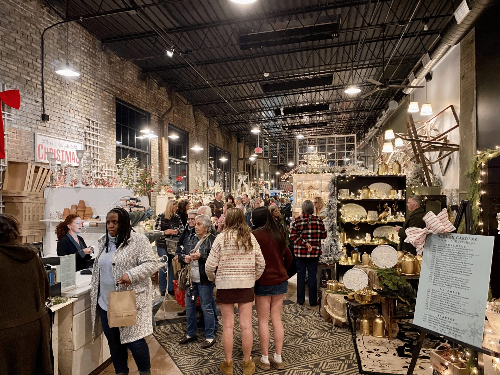 people shopping at Blumen Gardens' holiday soiree